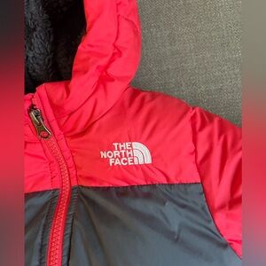 Patagonia toddler coat zip up with fleece interior and down filling.